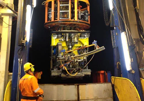 Offshore, preparing scanner for subsea inspection.